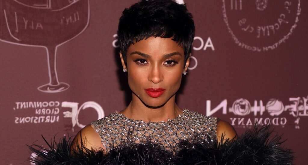 Hairstyle maintenance showcasing a woman with a sleek, short pixie haircut that complements a heart face shape.