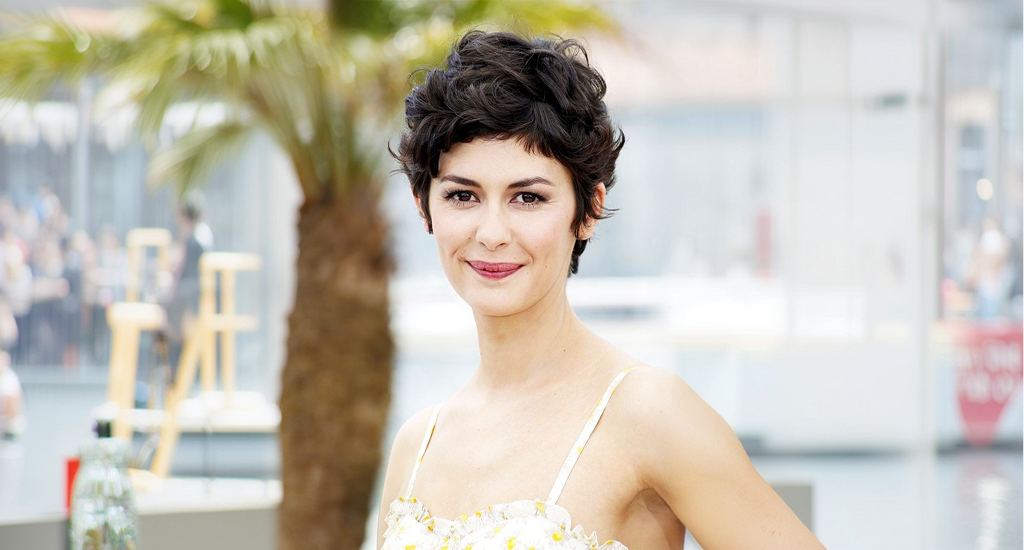 Hairstyle maintenance showcasing a woman with a textured pixie haircut that flatters facial features.