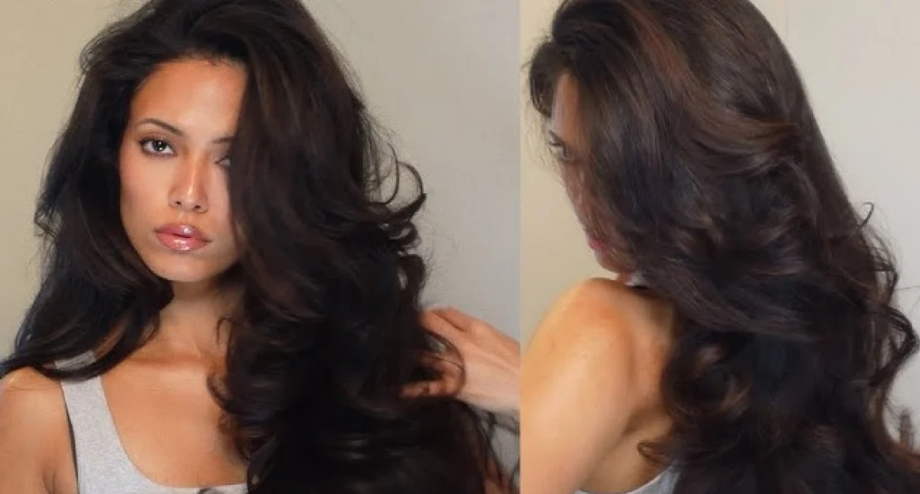 Front and back views of a woman showcasing a glamorous, high-volume blowout with long, cascading dark brown layers and bouncy curls.